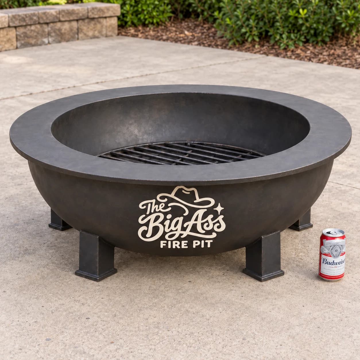 Broad Big Ass steel fire pit with surrounding ledge.