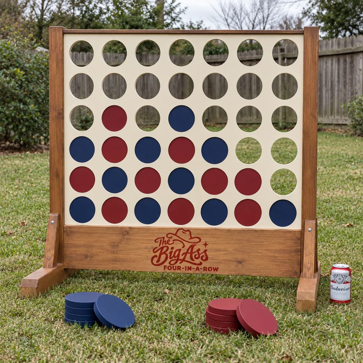 Freestanding Big Ass Four-in-a-Row wooden game frame with oversized colored discs.