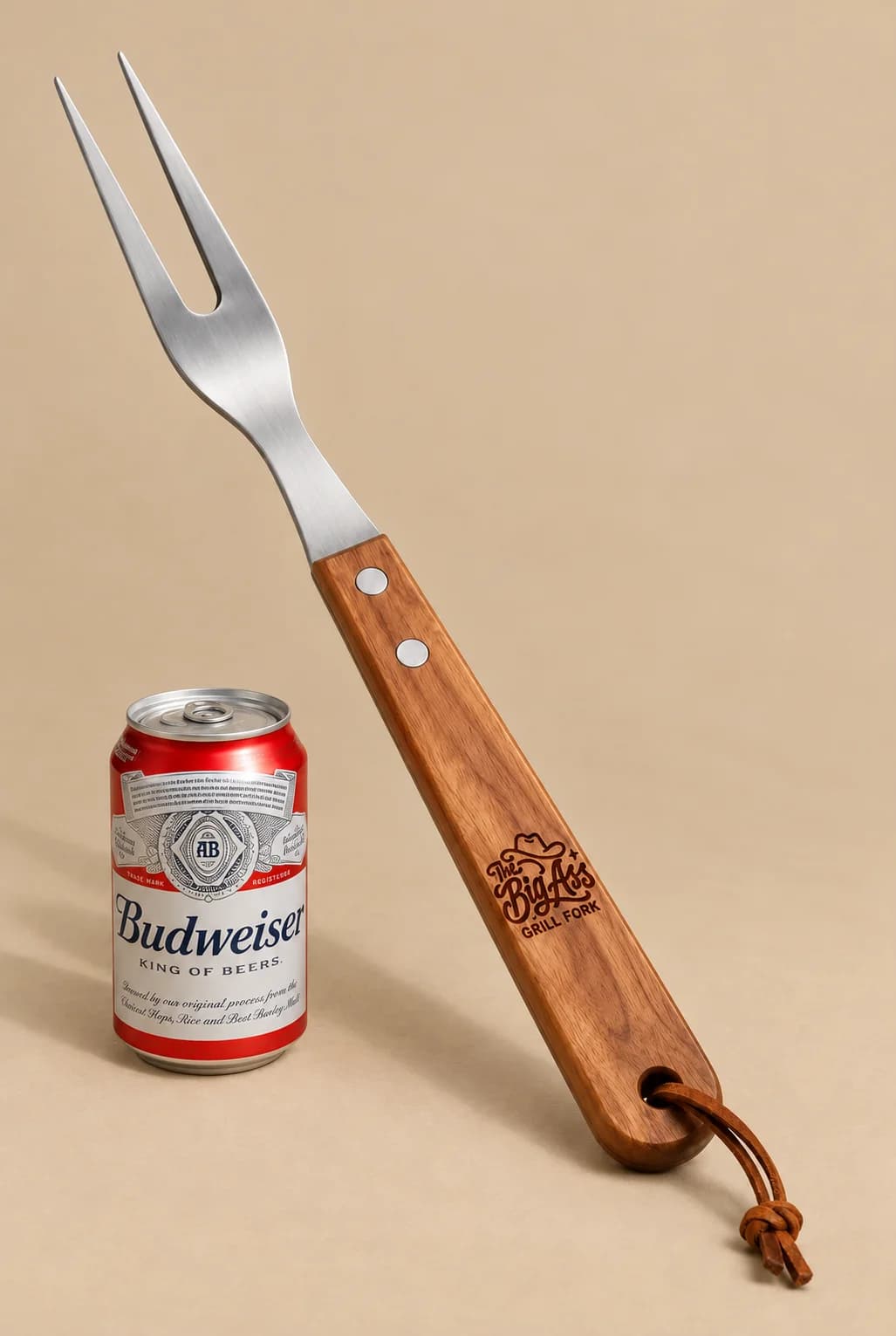 Oversized two-prong Big Ass Grill Fork with wooden handle.