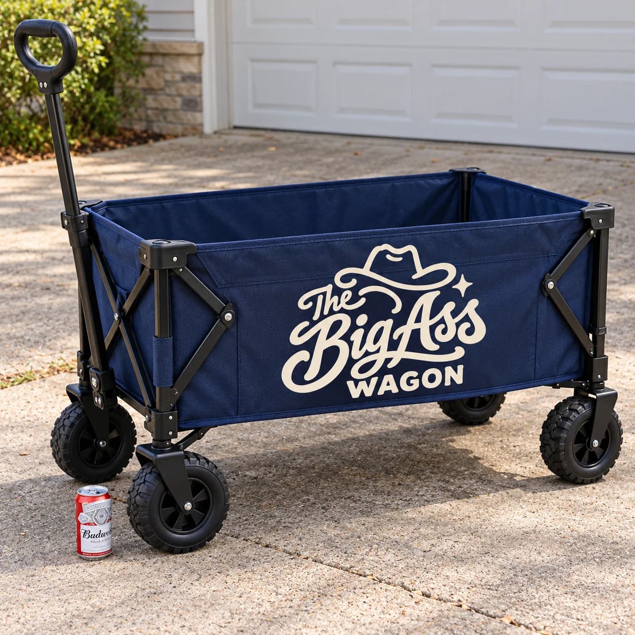 Broad outdoor cargo wagon with fabric sides, wheels and pull handle.