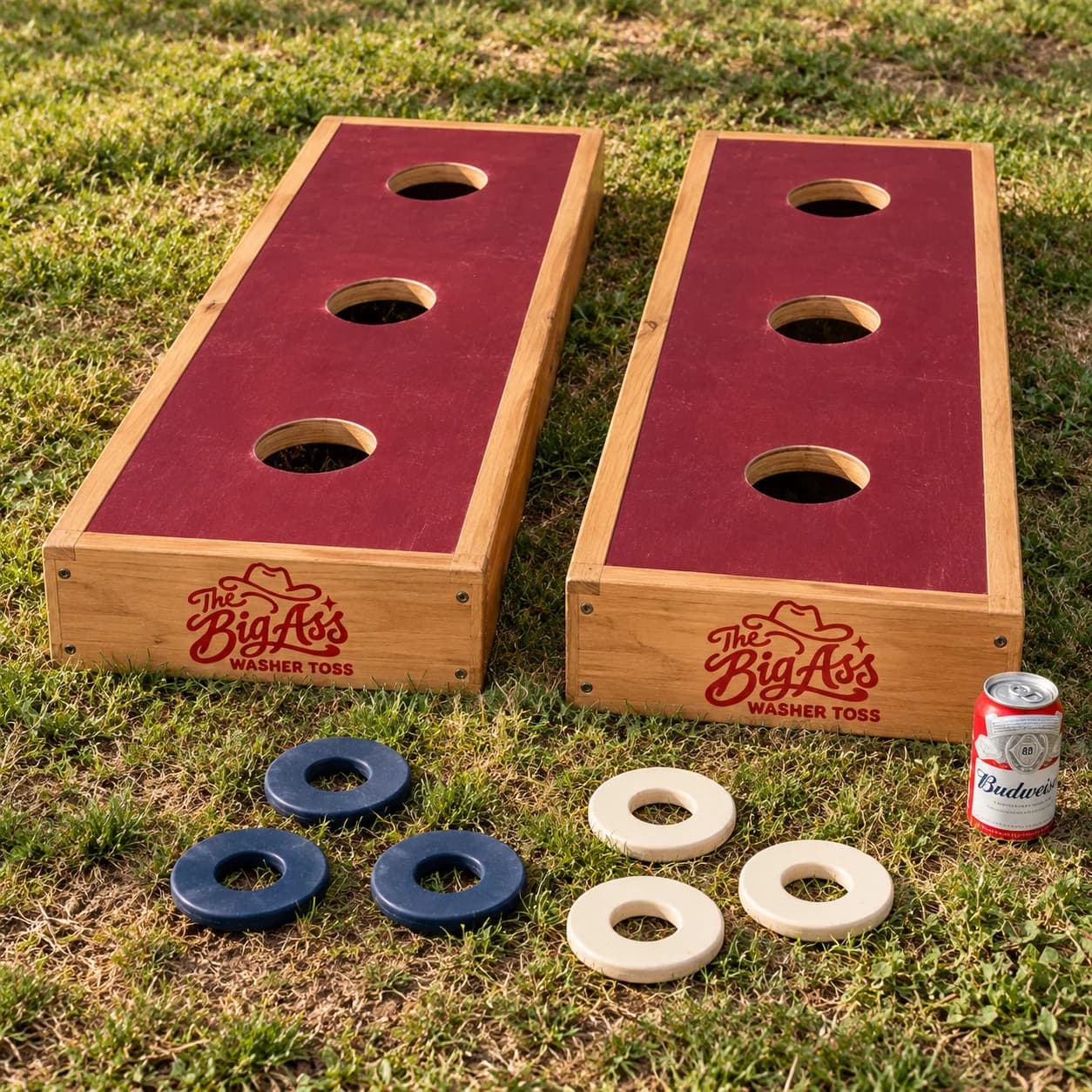 Wide wooden three-hole Big Ass Washer Toss boxes with oversized washers.