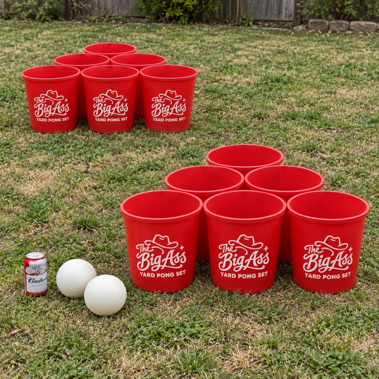 Bucket-sized red Big Ass Yard Pong targets arranged with large game balls.